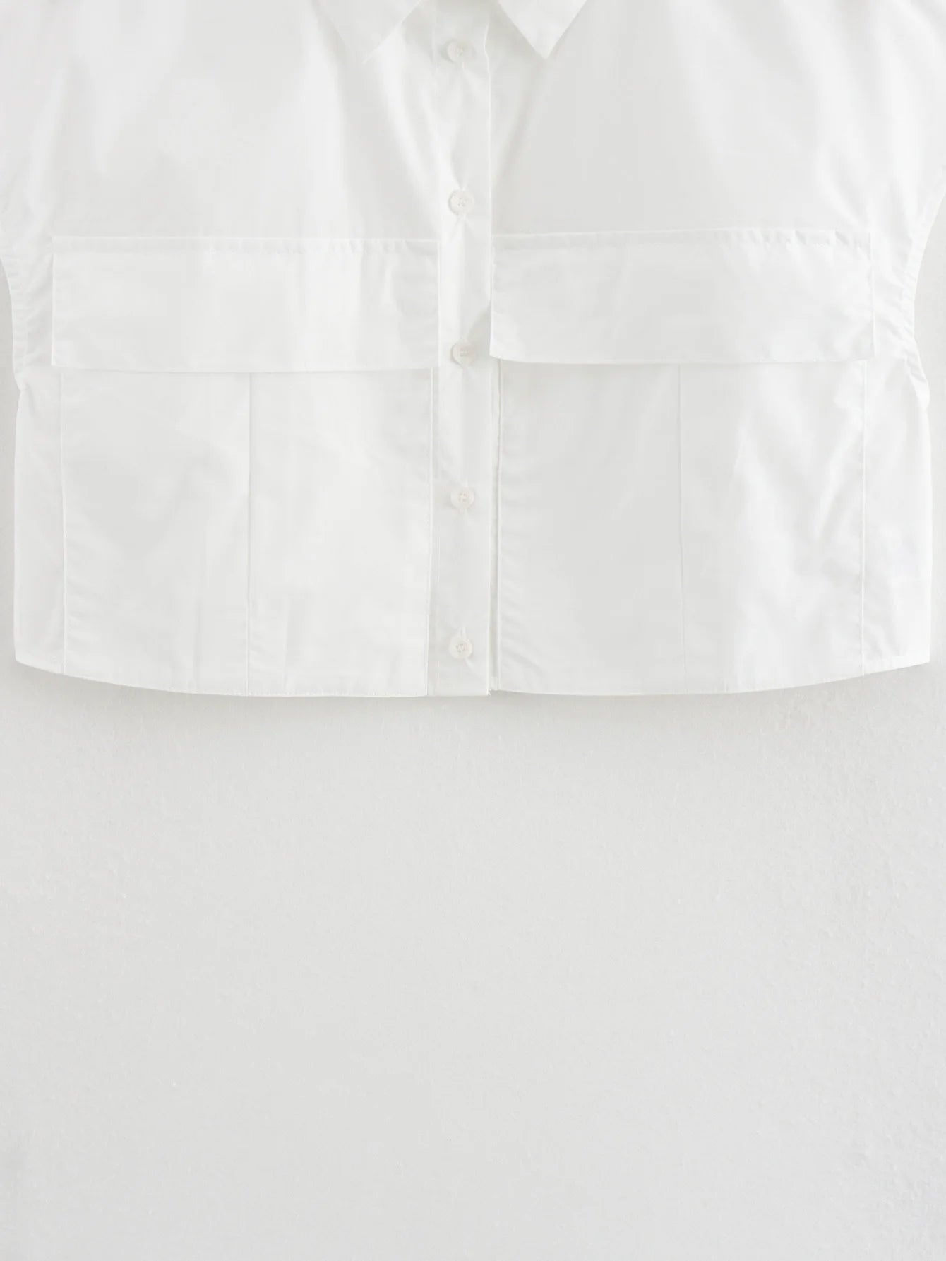 Solid Sleeveless Flip Pocket Short Top